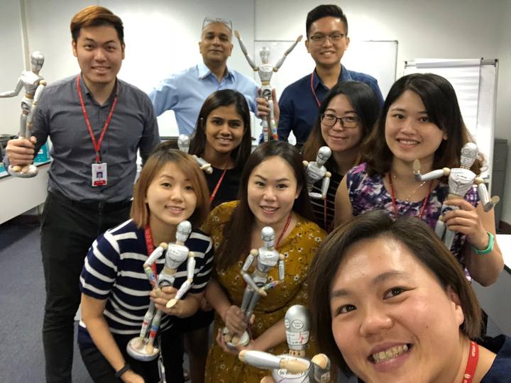 A workshop group holding their OSCAR figurines